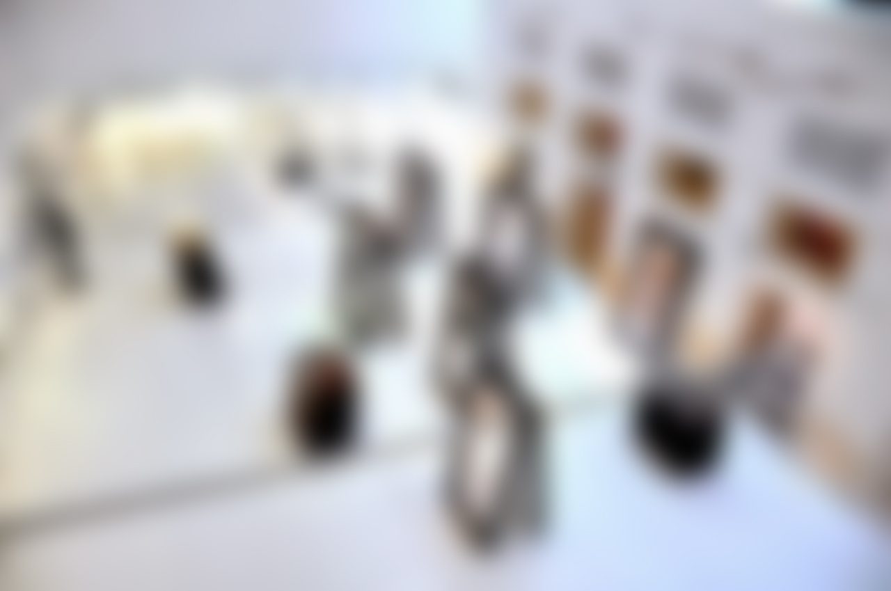 Blurry art gallery with displayed artworks inside.