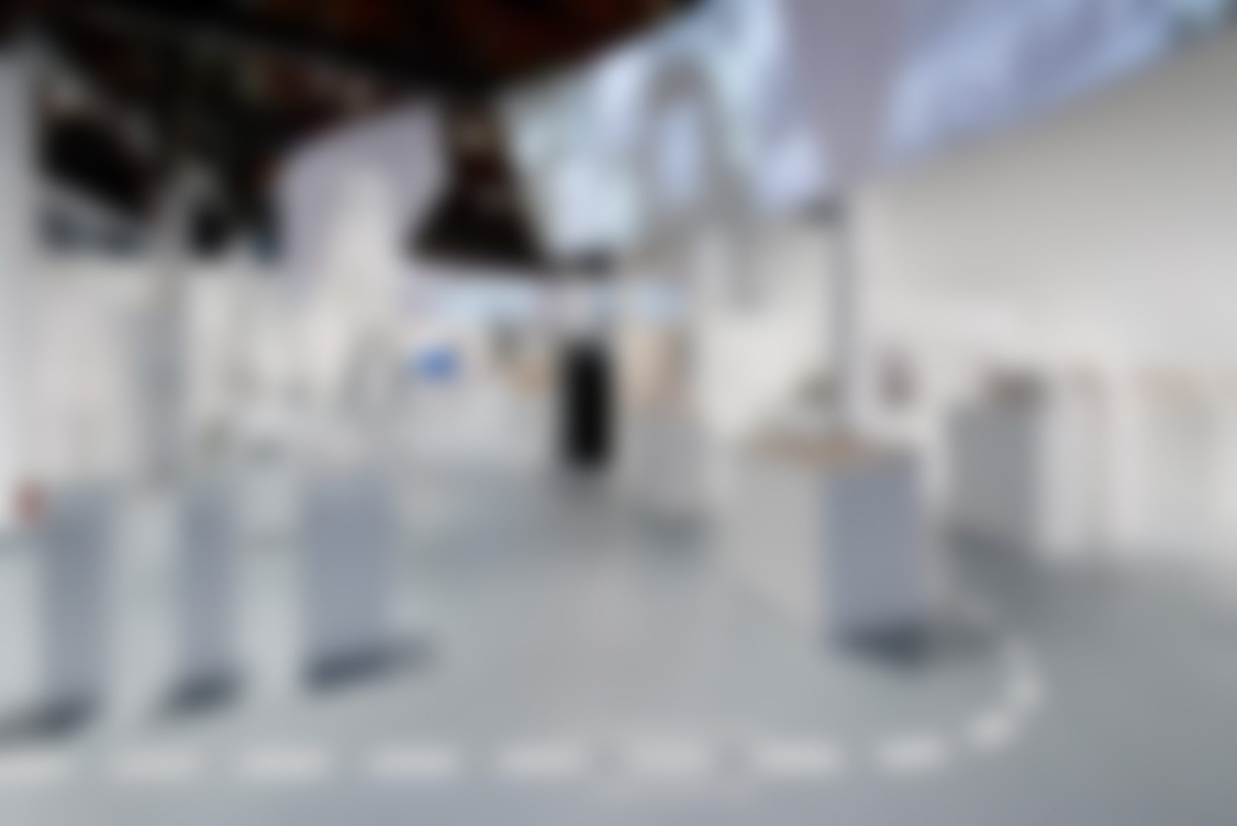 Contemporary art gallery interior with white displays