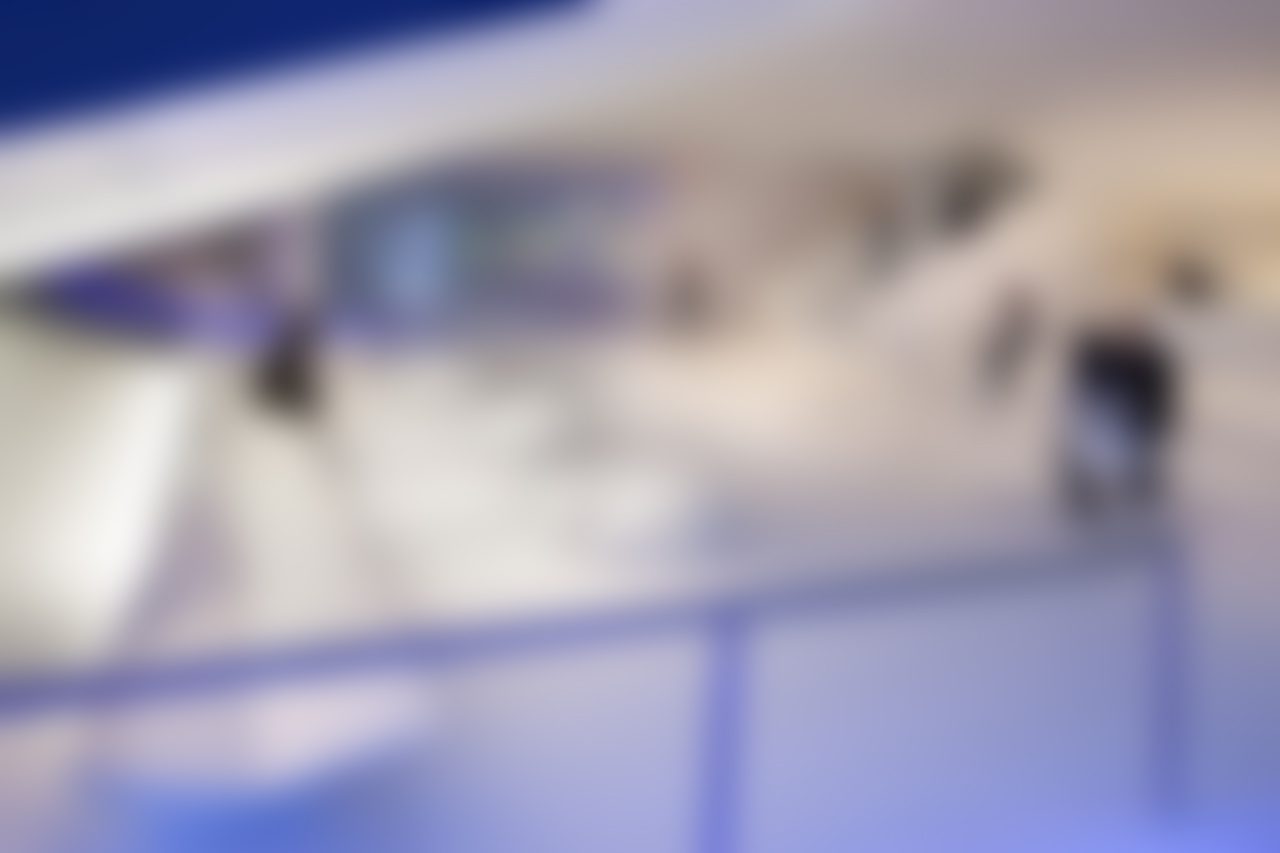 Blurry modern architectural interior with soft lighting.