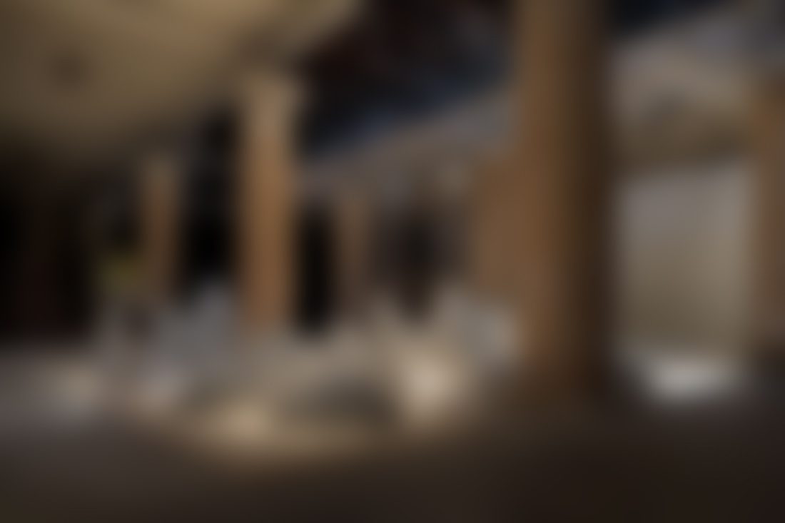 Ancient stone pillars in dimly lit interior.