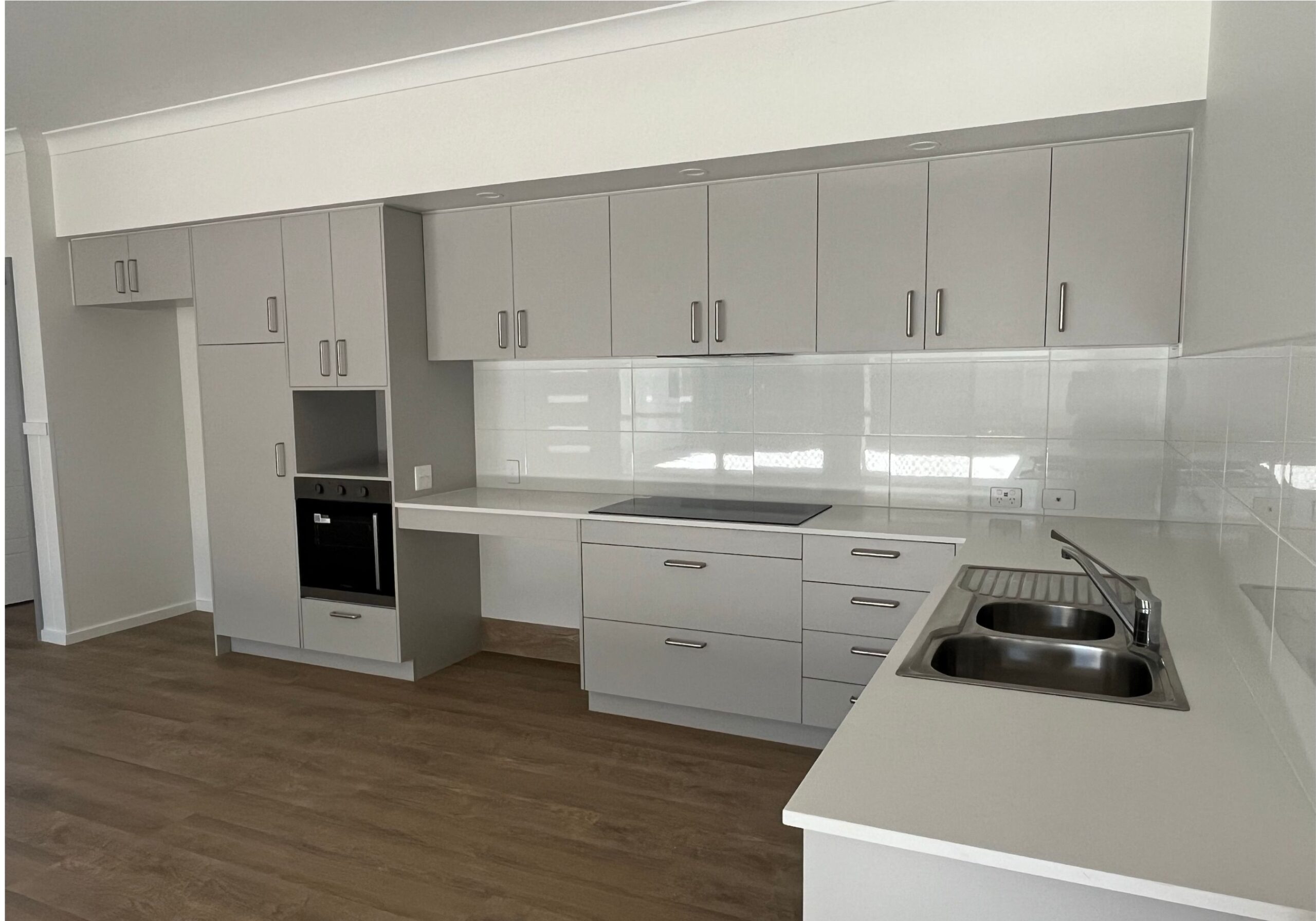 Modern kitchen with white cabinets and countertops