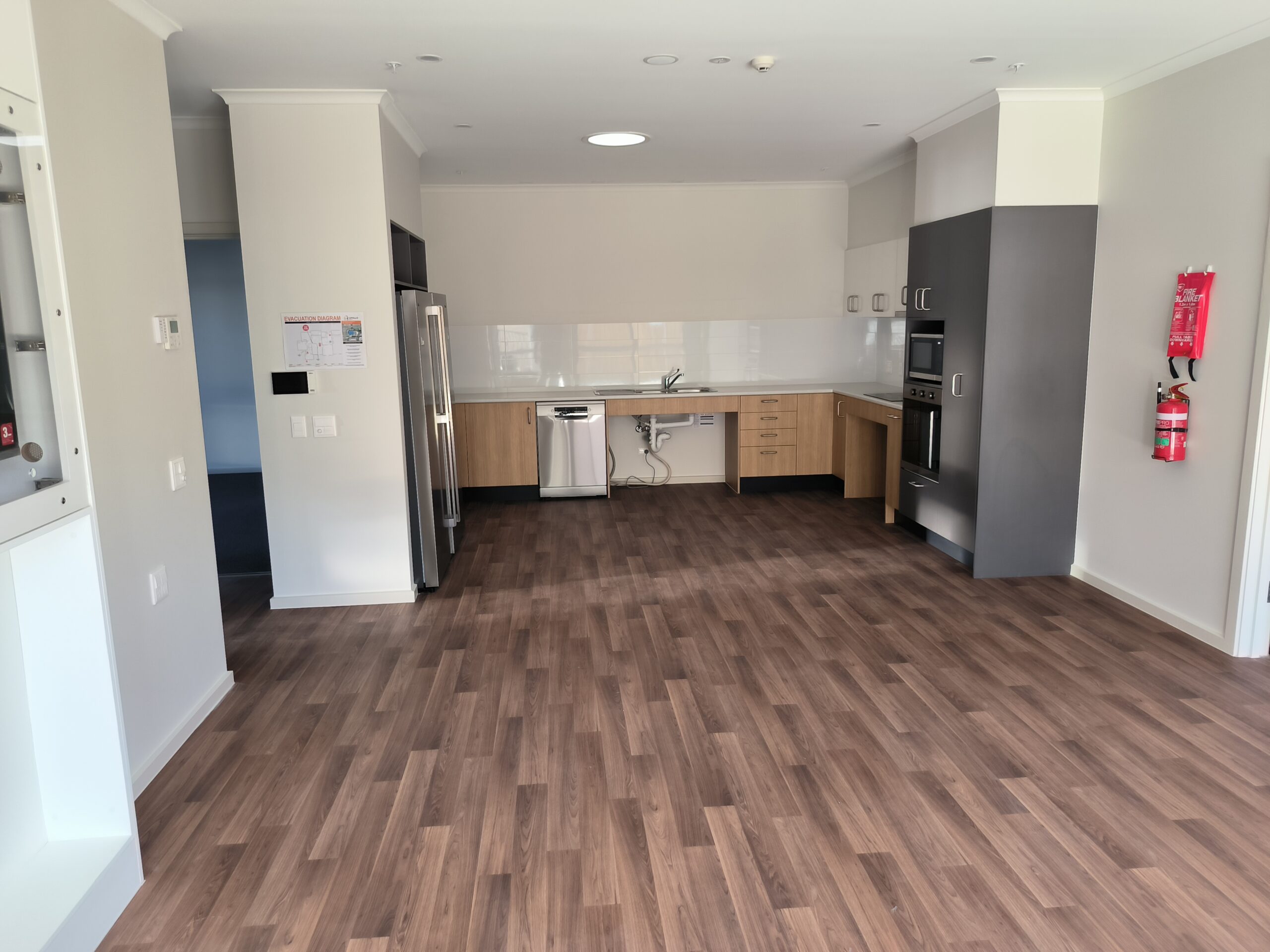 Modern spacious kitchen with wooden flooring design