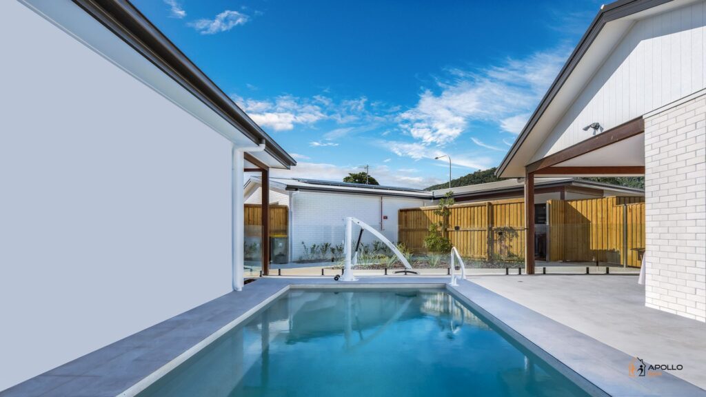 Modern backyard swimming pool with clear sky
