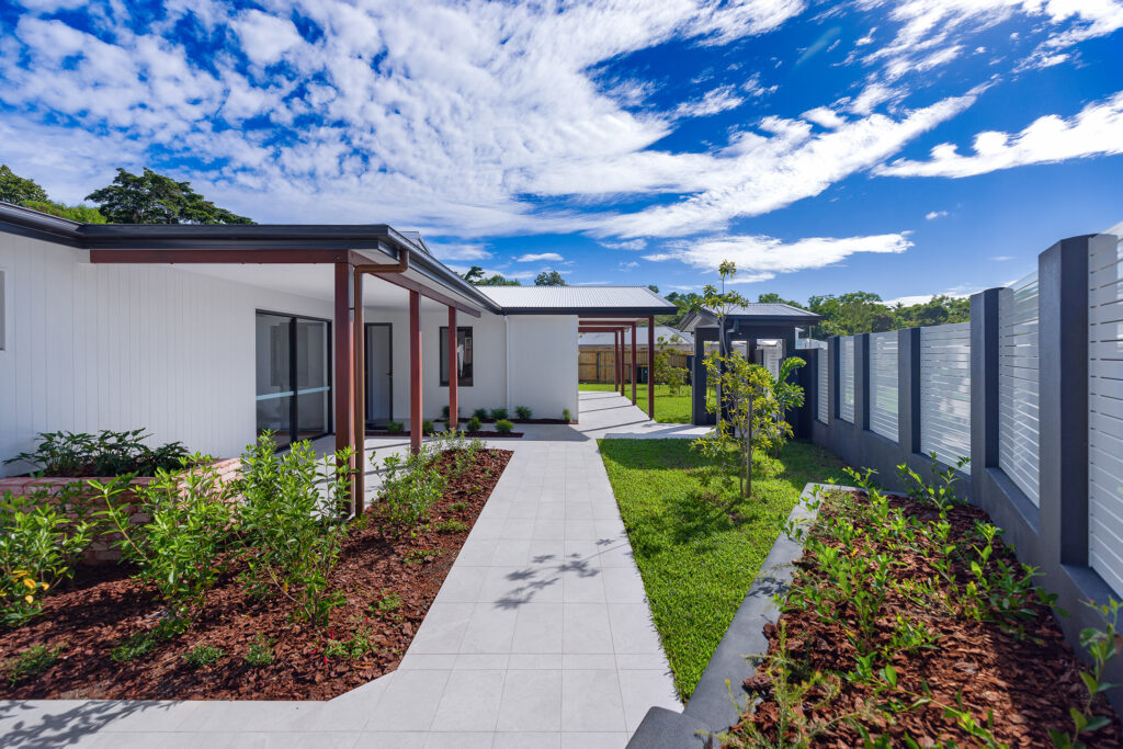 Modern home with landscaped garden under blue sky