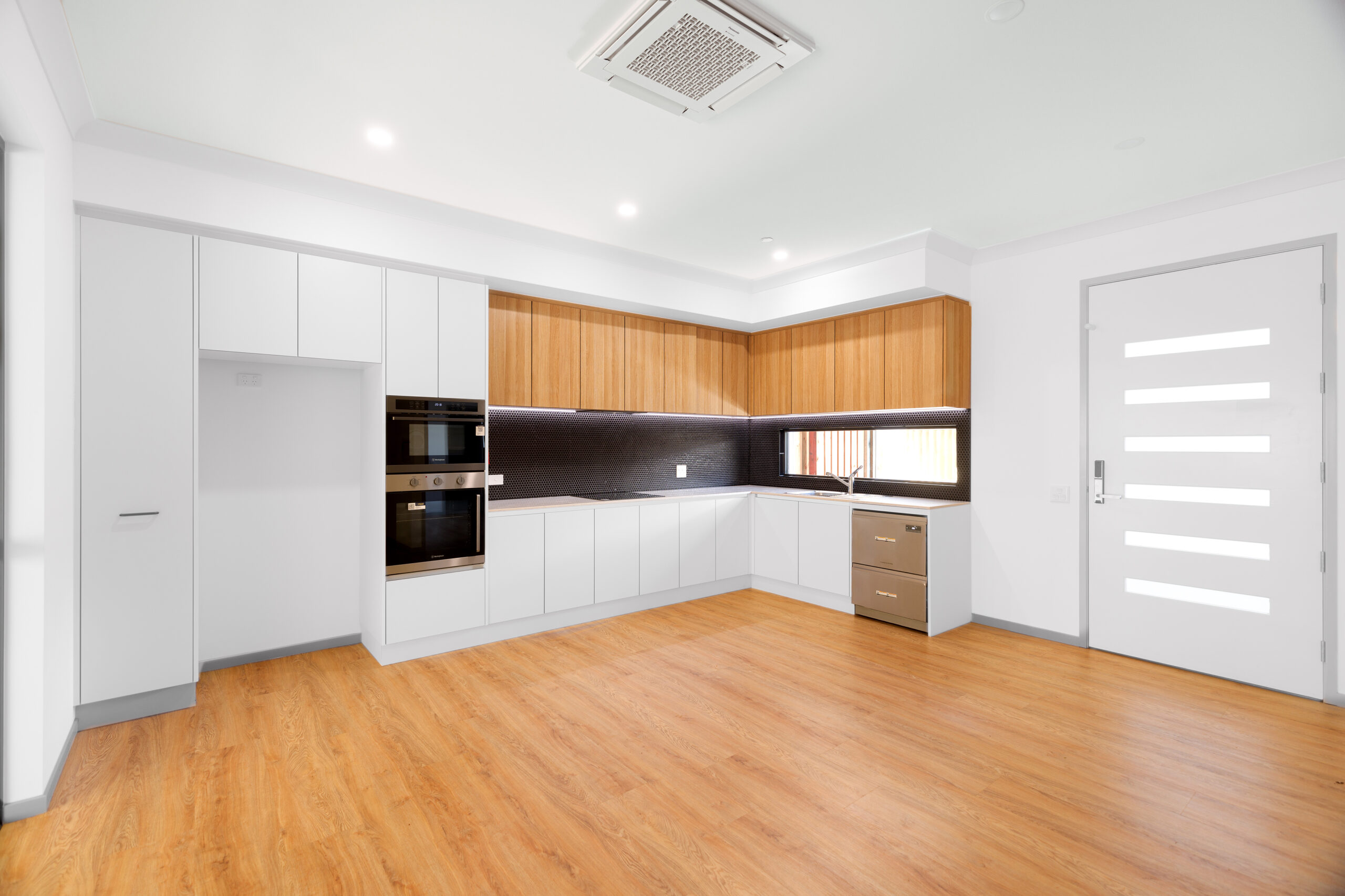 Header image 3 Modern kitchen with wooden flooring and cabinets